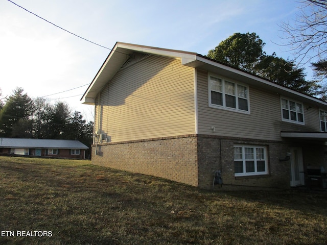 view of home's exterior featuring a lawn