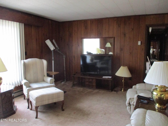 carpeted living room featuring baseboard heating and wood walls