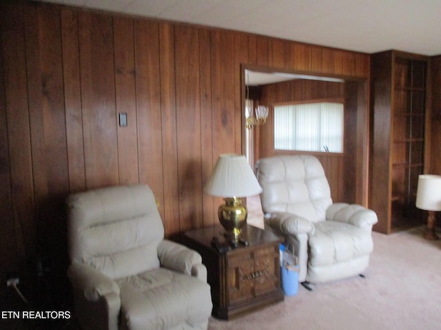 living area featuring wood walls