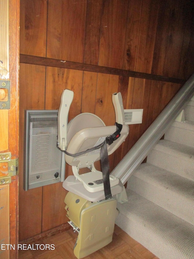 details featuring parquet floors and wood walls