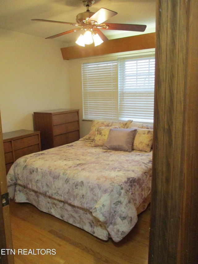 bedroom with hardwood / wood-style flooring and ceiling fan