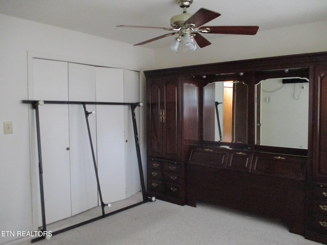 bedroom featuring ceiling fan and light carpet