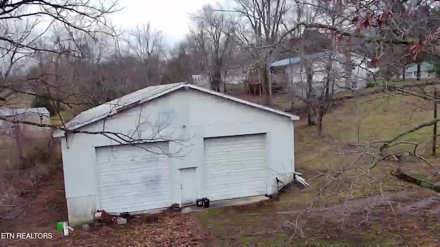 view of outbuilding featuring a garage