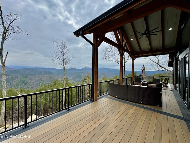 550 Steer Creek Rd, Tellico Plains, TN 37385 - deck featuring ceiling fan, an outdoor hangout area, and a mountain view