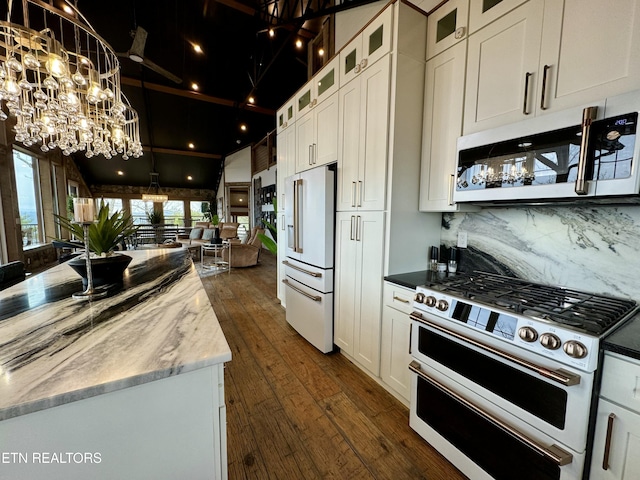 550 Steer Creek Rd, Tellico Plains, TN 37385 - kitchen with white cabinetry, dark wood-type flooring, dark stone counters, and high quality appliances