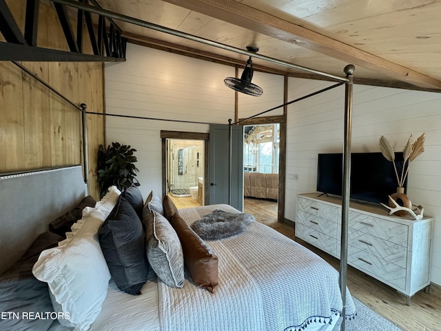 550 Steer Creek Rd, Tellico Plains, TN 37385 - bedroom with hardwood / wood-style floors, wooden walls, lofted ceiling with beams, wood ceiling, and ensuite bath