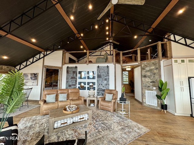 550 Steer Creek Rd, Tellico Plains, TN 37385 - living room with wood ceiling, beam ceiling, high vaulted ceiling, and light hardwood / wood-style flooring