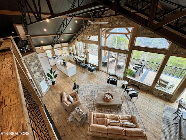 550 Steer Creek Rd, Tellico Plains, TN 37385 - unfurnished living room with hardwood / wood-style floors and high vaulted ceiling