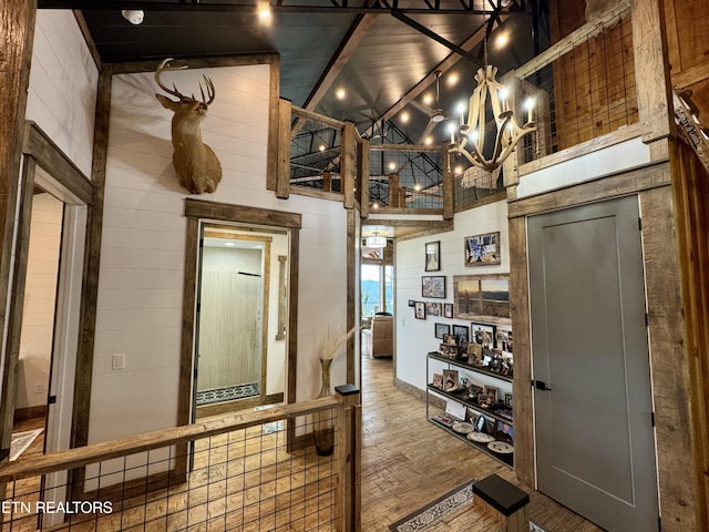 550 Steer Creek Rd, Tellico Plains, TN 37385 - interior space with hardwood / wood-style flooring, wooden walls, and high vaulted ceiling