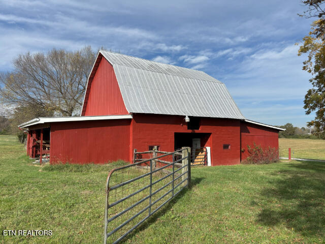 view of outbuilding featuring a yard