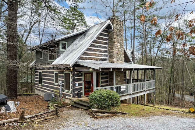 view of front of home with central AC unit and a porch