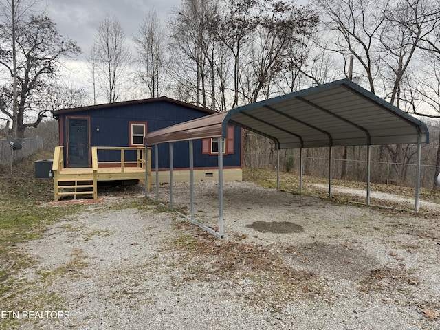 view of vehicle parking featuring a carport