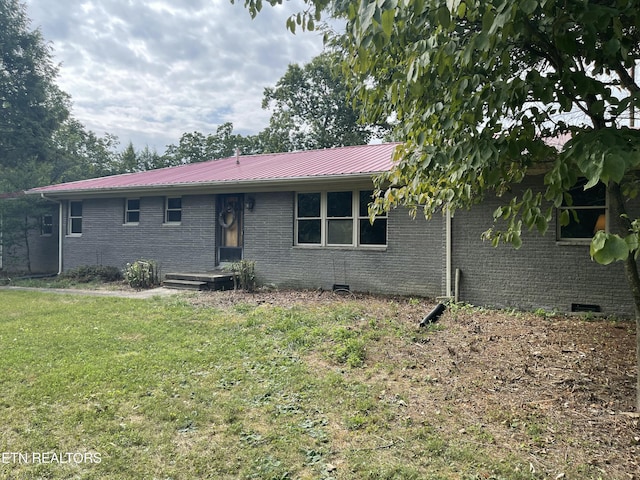 ranch-style house with a front lawn