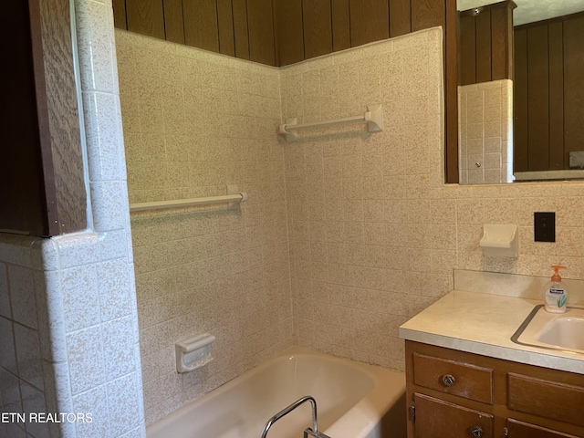 bathroom featuring vanity and decorative backsplash