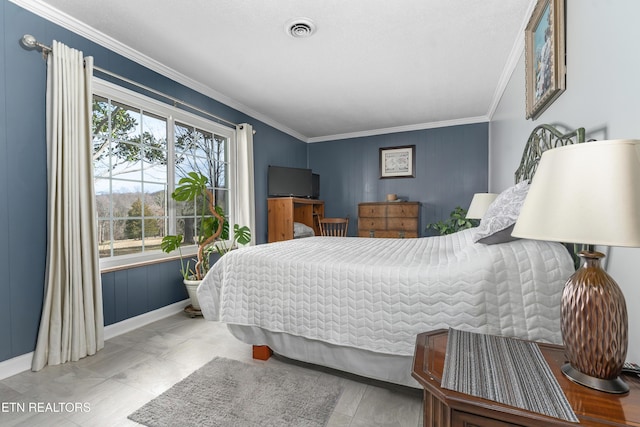 bedroom featuring crown molding