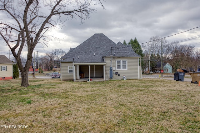 back of house with a yard