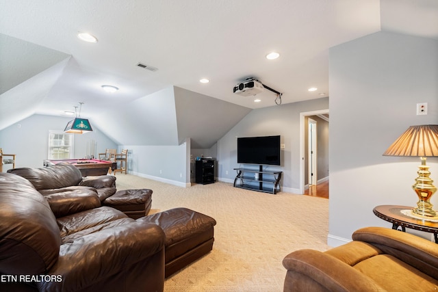 carpeted living room featuring lofted ceiling