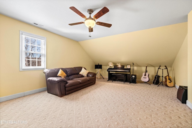 living room with lofted ceiling, light colored carpet, and ceiling fan