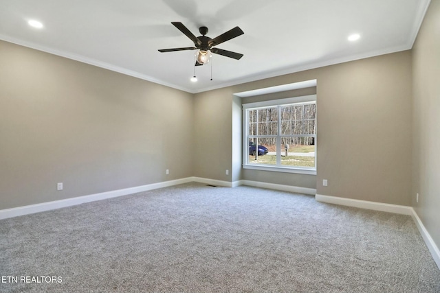 unfurnished room featuring crown molding, ceiling fan, and carpet flooring