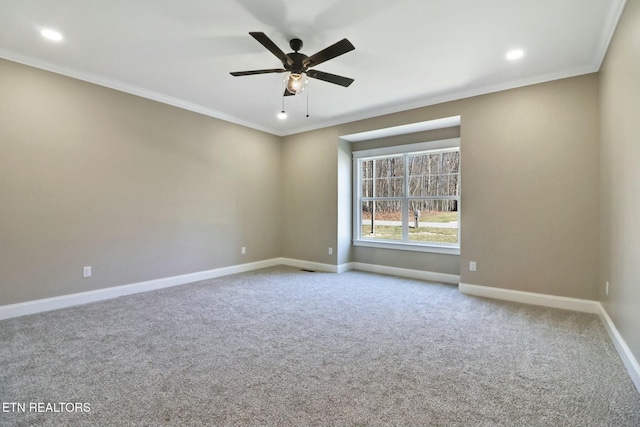 unfurnished room with ornamental molding, carpet floors, and ceiling fan