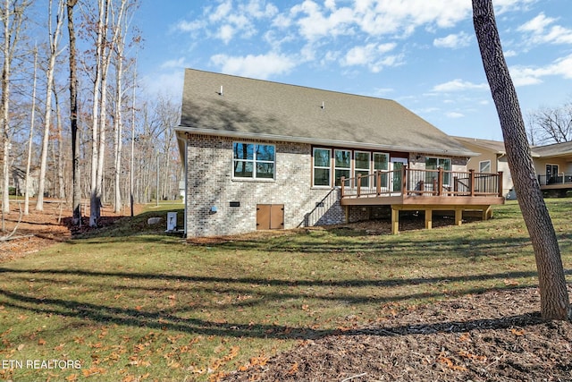 rear view of property with cooling unit, a yard, and a deck