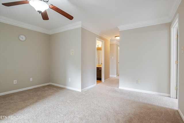 carpeted empty room with crown molding and ceiling fan