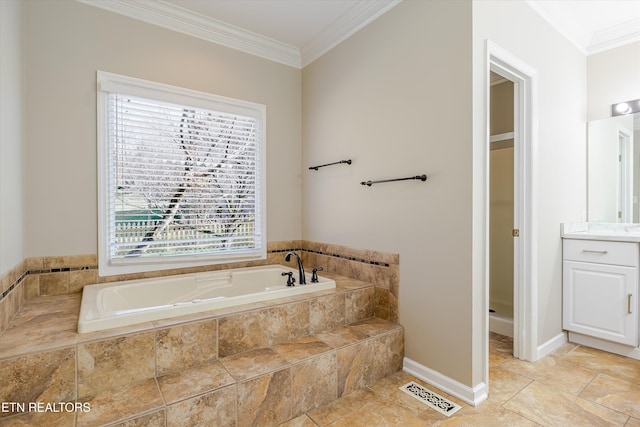 bathroom with tile patterned flooring, ornamental molding, a relaxing tiled tub, and vanity