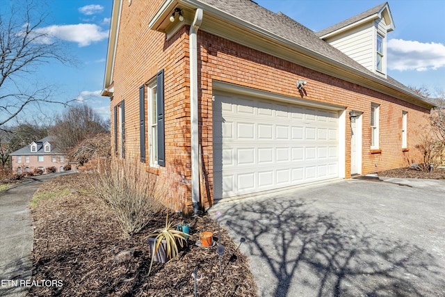 view of property exterior with a garage