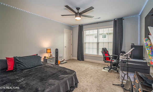 carpeted bedroom featuring ceiling fan