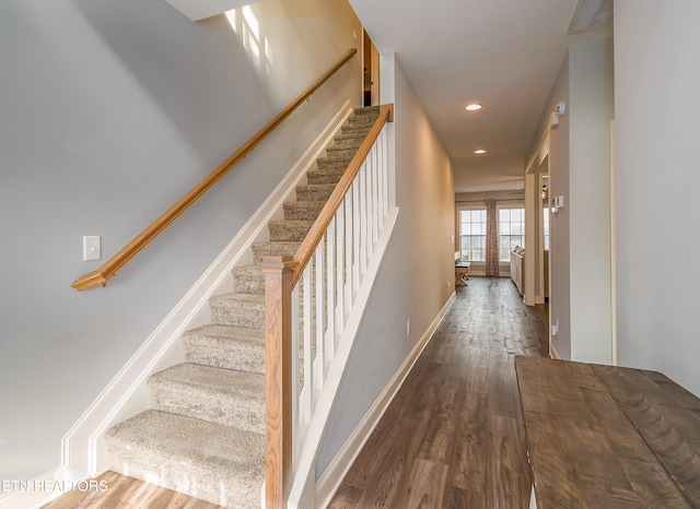 staircase featuring hardwood / wood-style floors