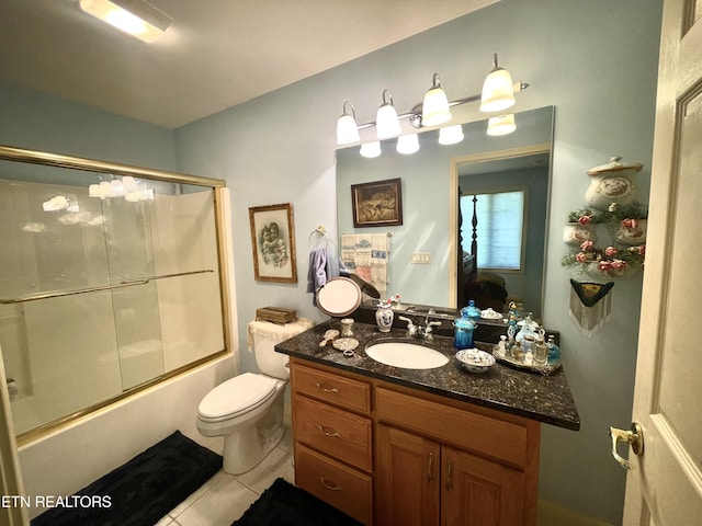 5001 Cheyenne Dr, Crossville, TN 38572 - full bathroom featuring vanity, tile patterned floors, bath / shower combo with glass door, and toilet