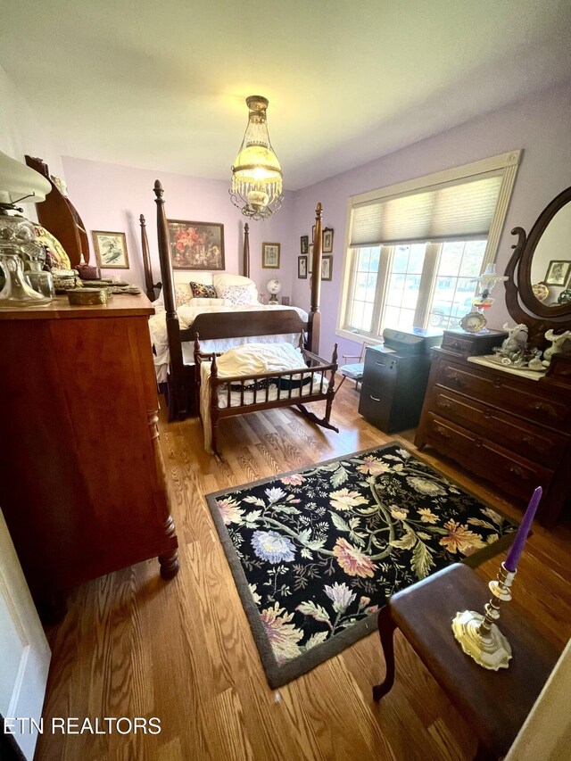 5001 Cheyenne Dr, Crossville, TN 38572 - bedroom with a chandelier and wood finished floors