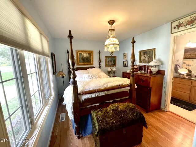 5001 Cheyenne Dr, Crossville, TN 38572 - bedroom with wood finished floors and a chandelier