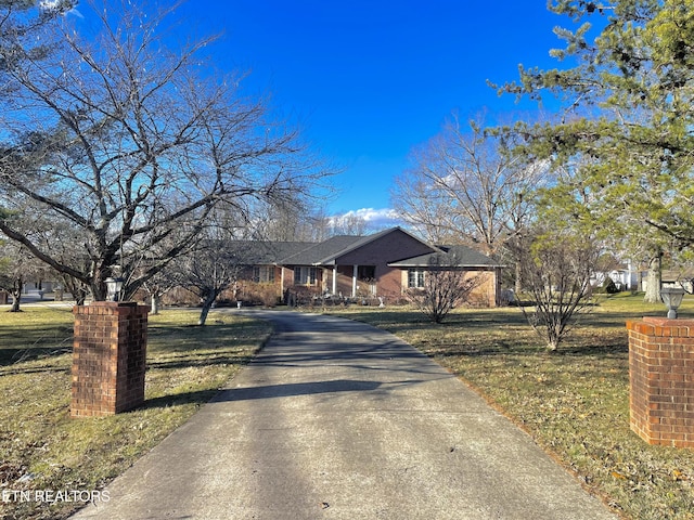 5001 Cheyenne Dr, Crossville, TN 38572 - single story home featuring a front lawn and asphalt driveway