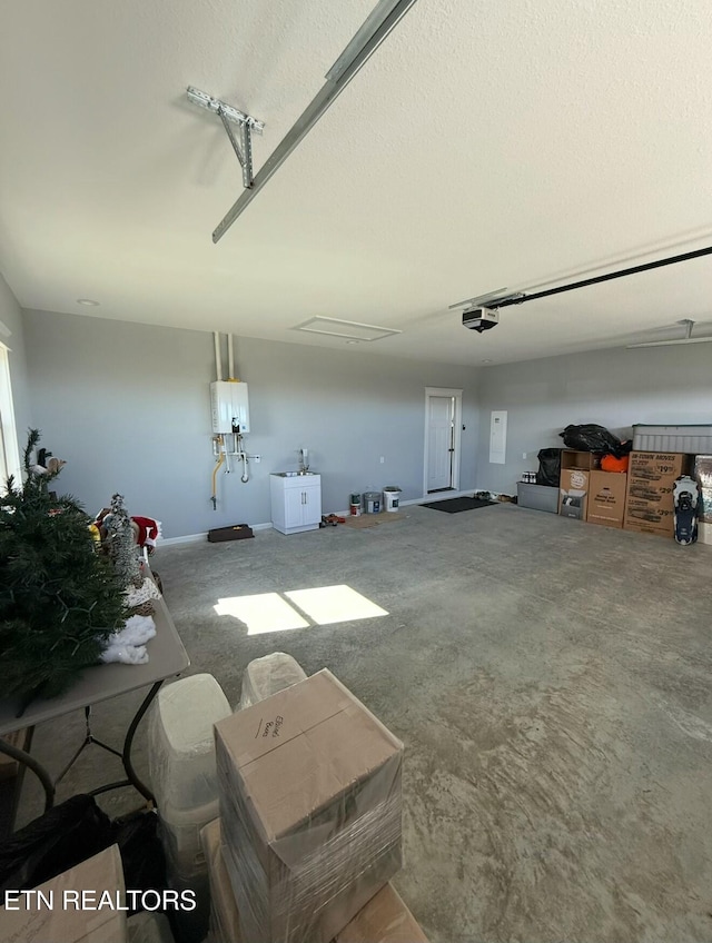 garage with a garage door opener and water heater