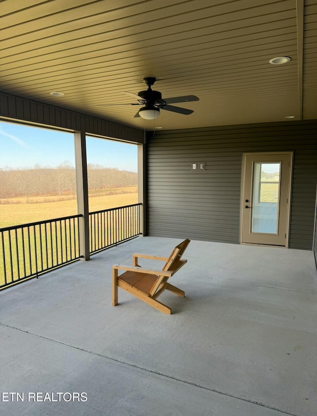 view of patio featuring a rural view and ceiling fan