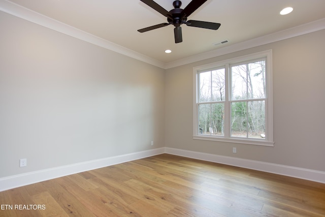 unfurnished room with light hardwood / wood-style flooring, ornamental molding, and ceiling fan