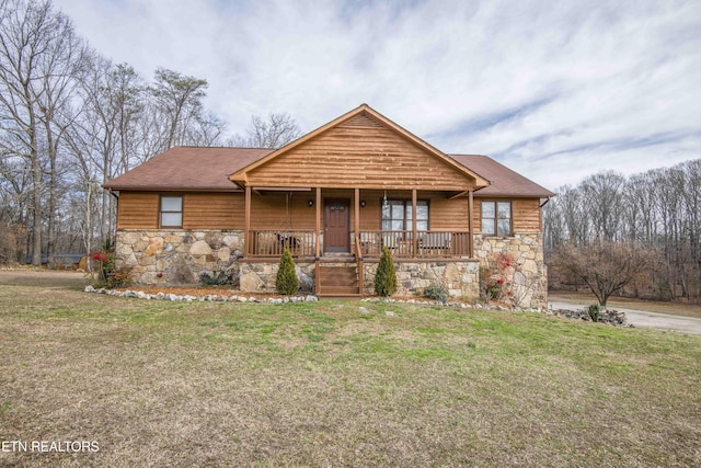 view of front of home with covered porch and a front yard