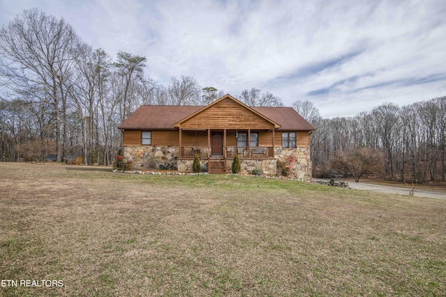 view of front of home featuring a front yard and covered porch