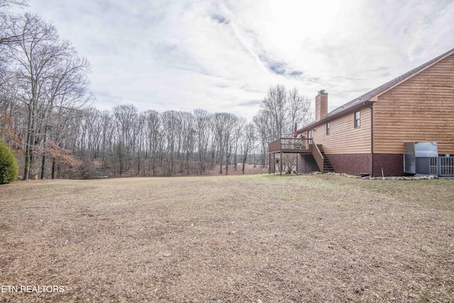 view of yard featuring a wooden deck