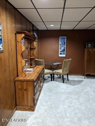 office featuring light carpet and a paneled ceiling