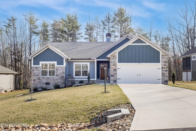 view of front of property with a garage and a front yard