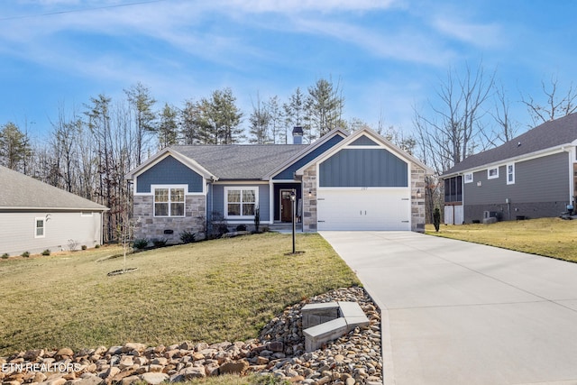 view of front of home featuring a garage and a front lawn