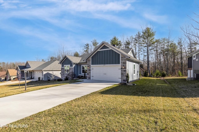 view of front of home with a garage and a front lawn