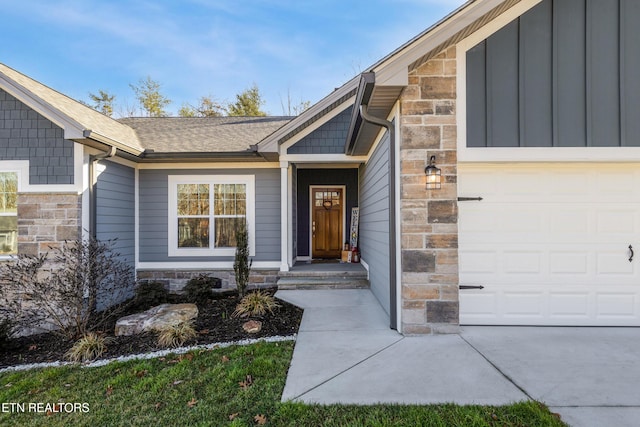 view of exterior entry featuring a garage