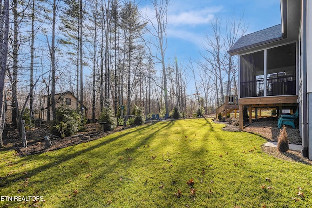 view of yard with a sunroom