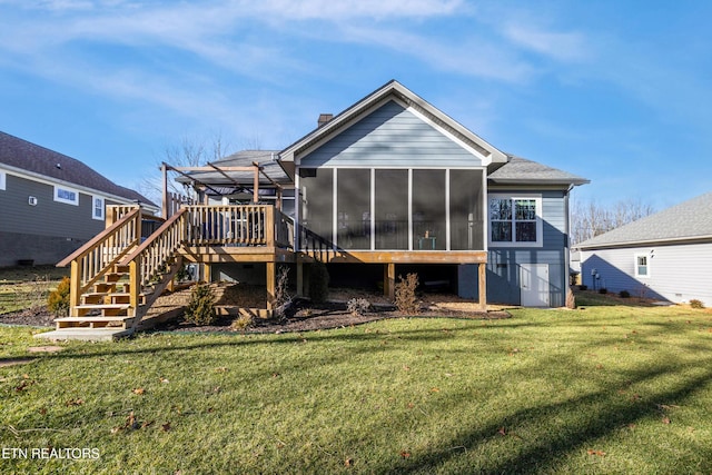 rear view of property with a wooden deck, a sunroom, a pergola, and a lawn