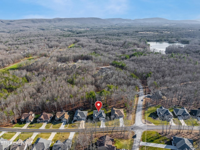 drone / aerial view with a water and mountain view