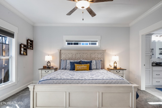 carpeted bedroom featuring ceiling fan, ornamental molding, and sink