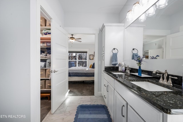 bathroom featuring vanity and ceiling fan